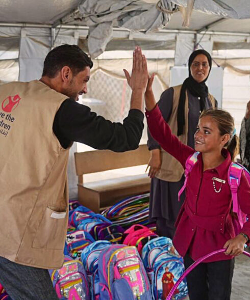20251219 Children receiving their school bags and kits from Save the Children header